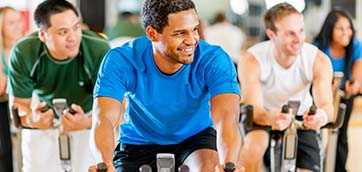 Active And Fit Enterprise: People on stationary bikes