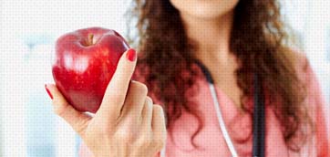 Doctor holding an apple